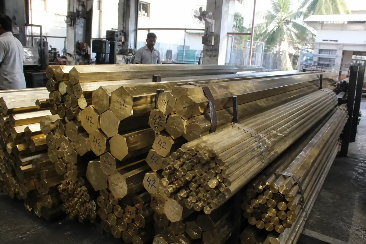 Extruded brass rods, hexagonal bars, and billets stacked in a Jamnagar mill
