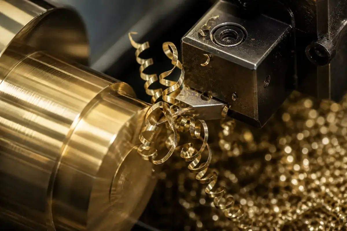 Macro photograph of clean broken brass chips during high speed CNC lathe machining